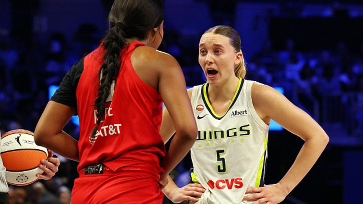 Paige Bueckers and Angel Reese exchange words during a WNBA game.