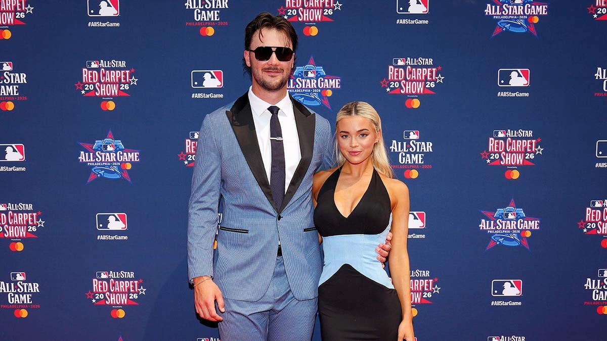 Paul Skenes poses with Olivia Dunne at the red carpet show in Philadelphia.