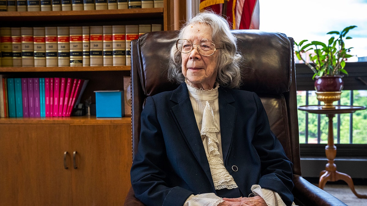 Pauline Newman sitting at her office desk surrounded by books and documents in Washington, D.C.