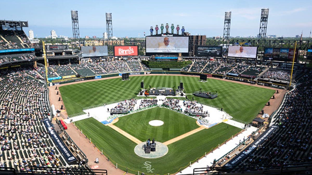 Pope Leo XIV appears on the scoreboard at Rate Field during a celebration in Chicago.