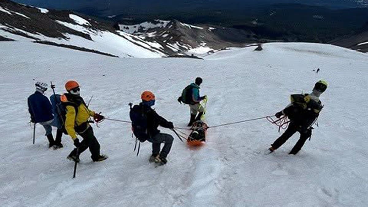 Rescuers transport injured climber down Mount Shasta