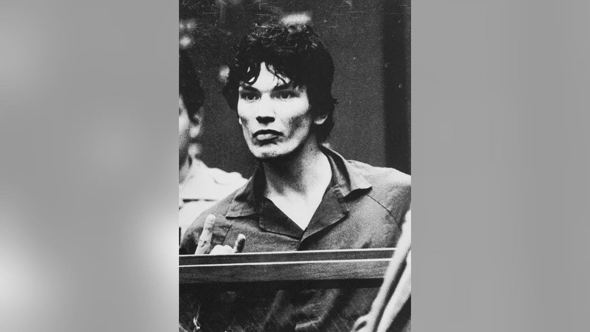 Richard Ramirez gestures in courtroom during trial proceedings.
