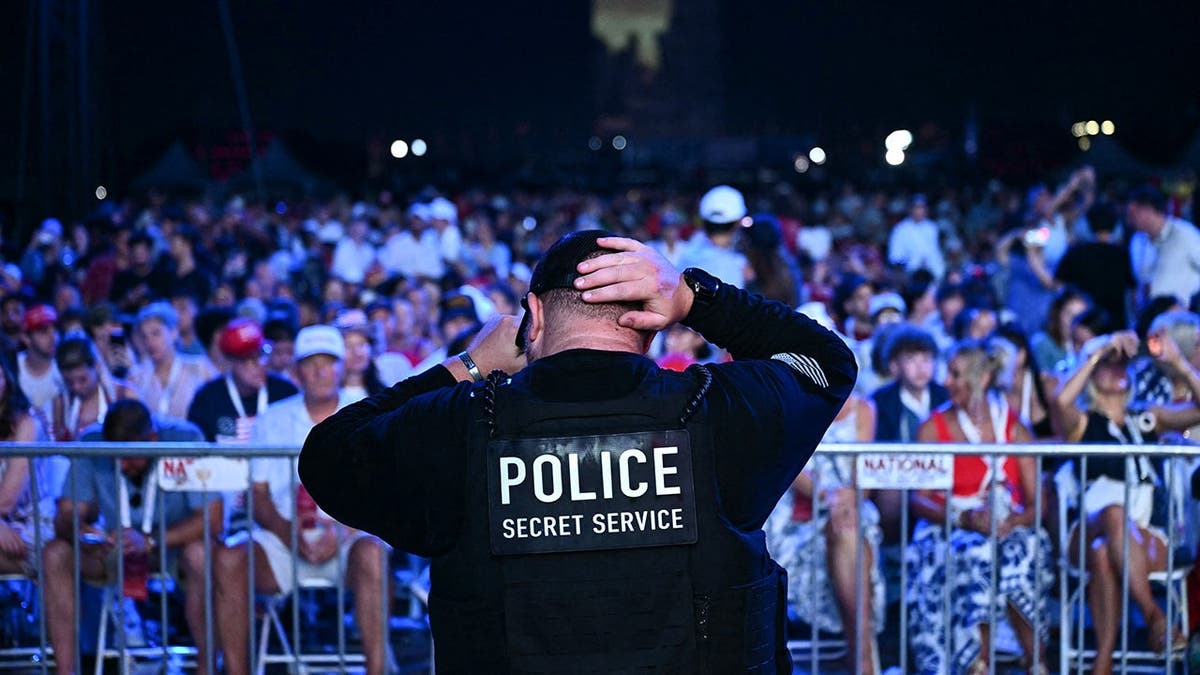 Secret Service personnel stands arsenic assemblage waits for President Trump connected National Mall.