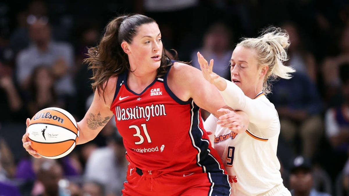 Sophie Cunningham of the Phoenix Mercury pressures Stefanie Dolson of the Washington Mystics during a WNBA game.