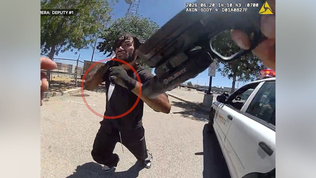Body camera image shows a man holding a knife as he confronts a Los Angeles County sheriff's deputy during a June 20 incident in Lancaster, California.