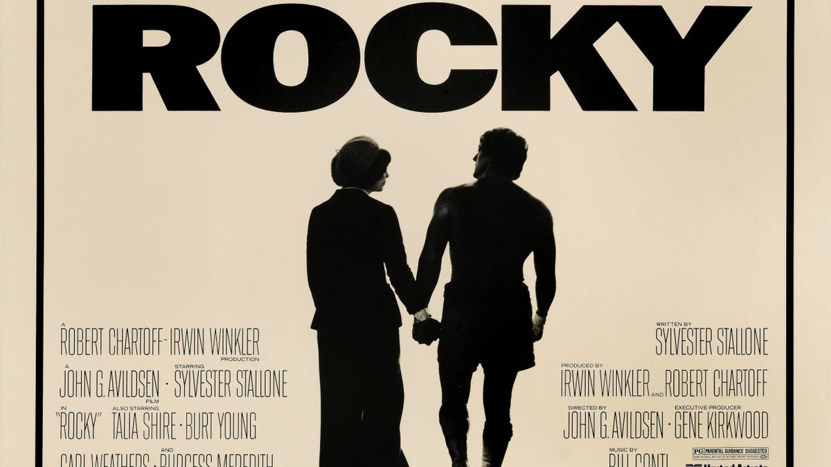 Talia Shire and Sylvester Stallone appear on a Rocky movie poster.