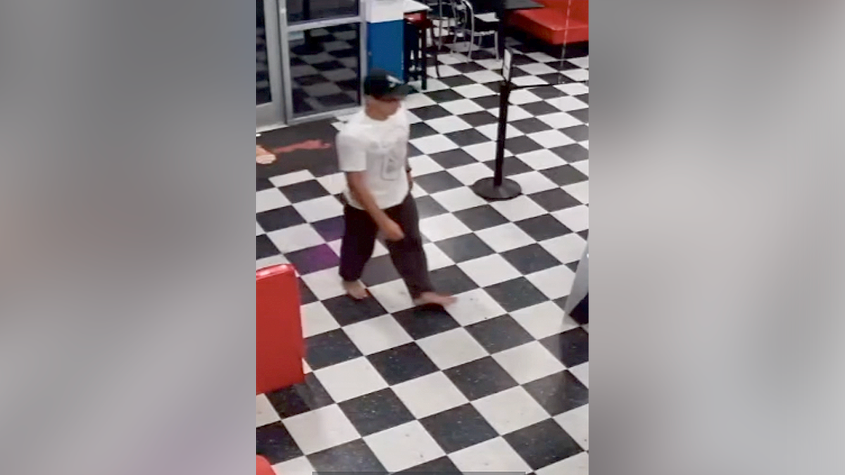 Surveillance video shows the barefoot suspect entering Mister Softee in Camarillo moments before carrying off a Taylor Swift cardboard cutout
