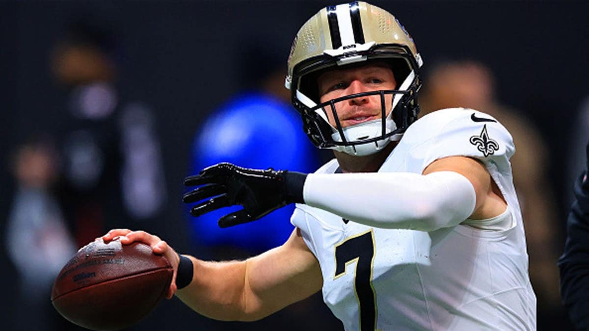 Taysom Hill warms up before an NFL game at Mercedes-Benz Stadium in Atlanta.