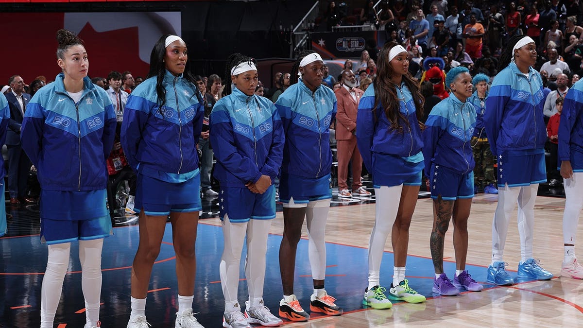 Team Spoon stands for the national anthem at the United Center.