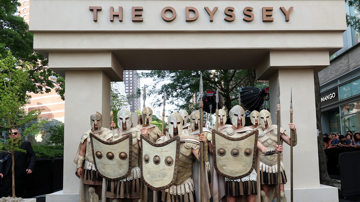 Actors dressed as Greek soldiers at the premiere of "The Odyssey"