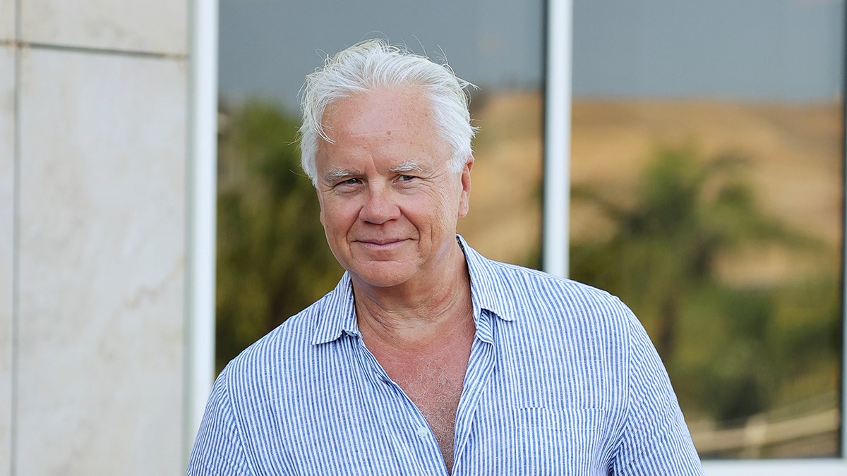 Tim Robbins speaks during a press conference at the Magna Graecia Film Festival in an indoor venue.