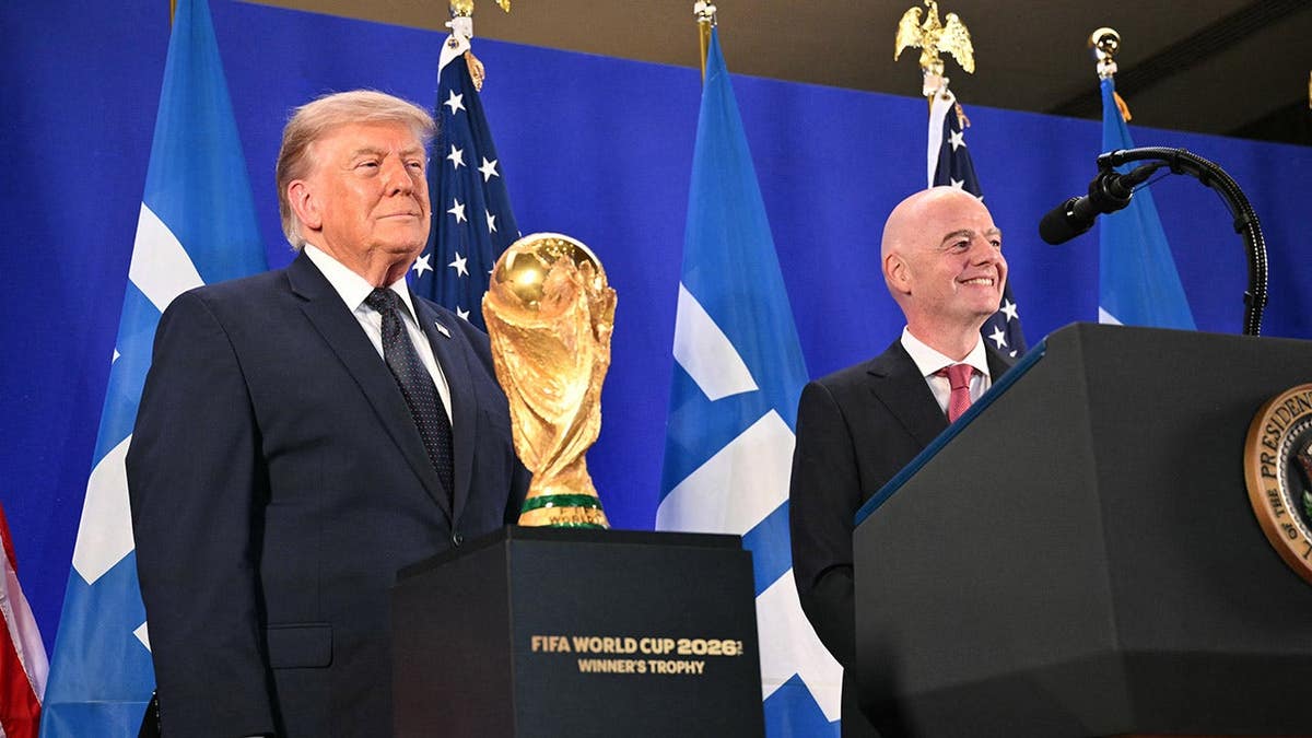 Donald Trump and Gianni Infantino stand at a FIFA reception in New York.