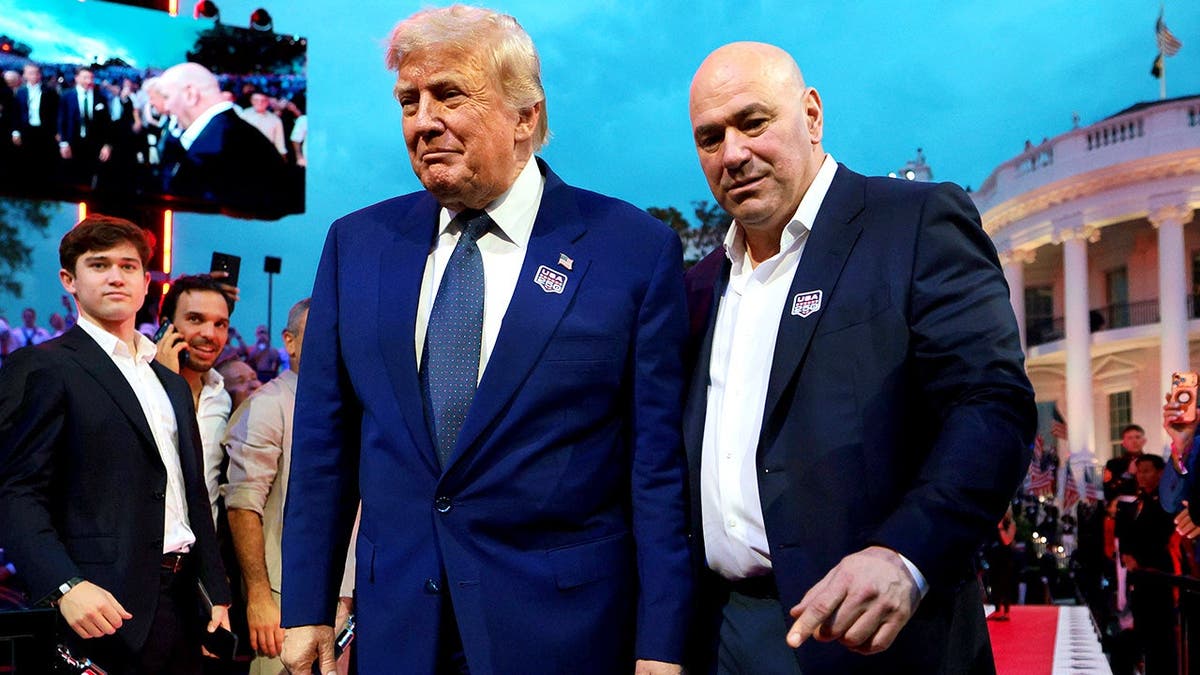 Donald Trump and Dana White walk onto White House South Lawn for UFC event.