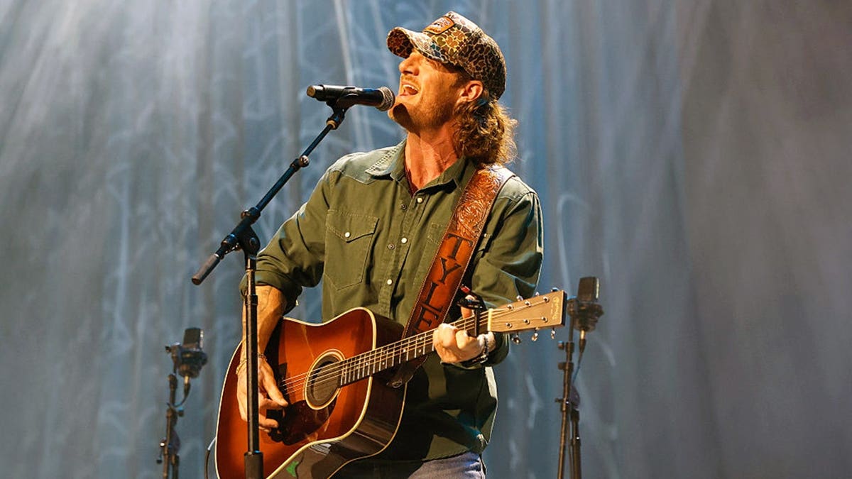 Tyler Hubbard performs on stage at the Ryman Auditorium in Nashville.