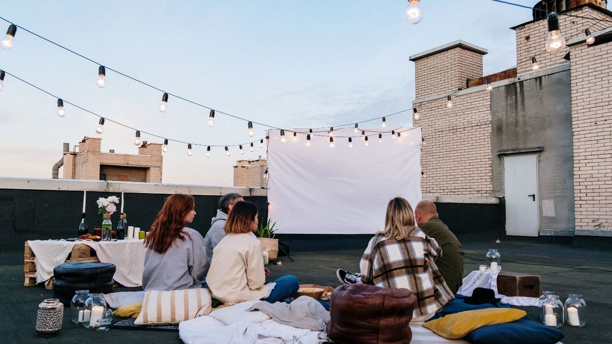 People in front of a projector