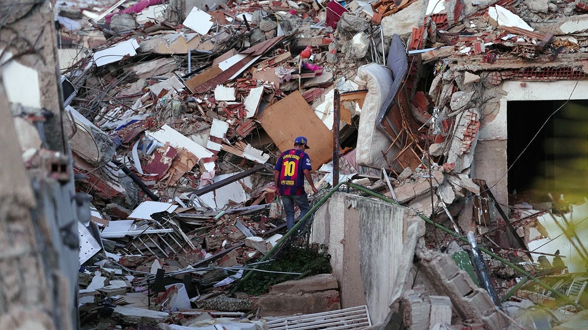 man stands connected earthquake rubble successful Venezuela