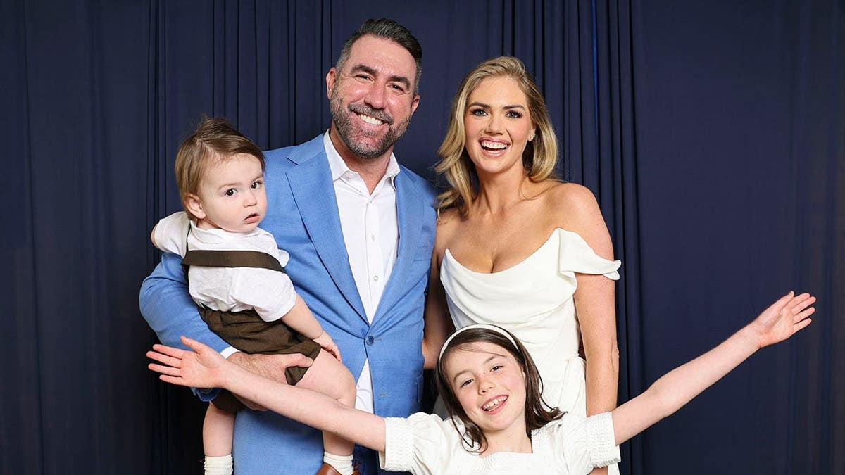 Justin Verlander poses with Kate Upton and family at Loews Philadelphia.