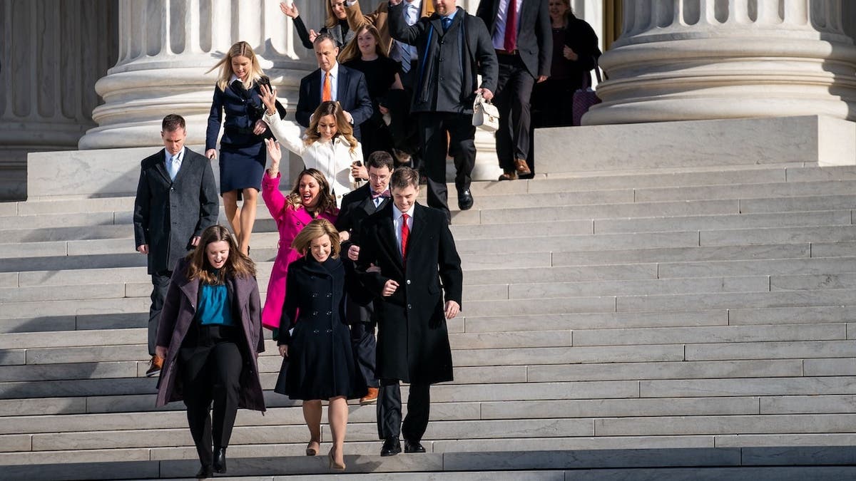Lorie Smith walks out of the Supreme Court with Kristen Waggoner in Washington, D.C.
