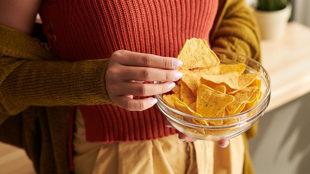 Woman eating chips