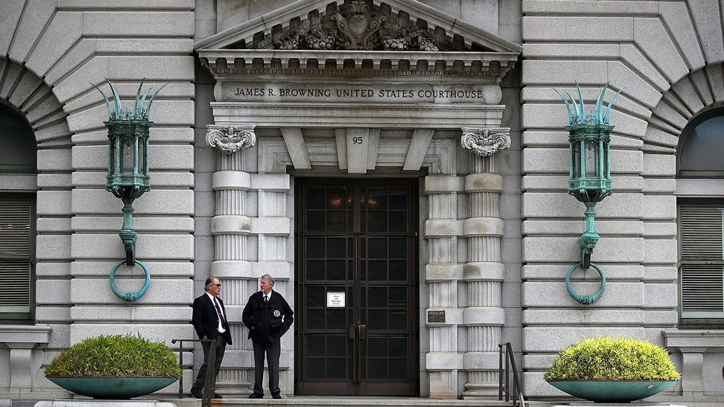 Security guards stand in front of the Ninth U.S. Circuit Court of Appeals building in San Francisco.