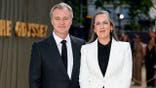 Christopher Nolan and Emma Thomas pose for photographers at The Odyssey world premiere in London.