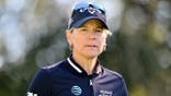 Annika Sorenstam looks on