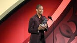 Don Lemon accepts an award onstage at the Webby Awards
