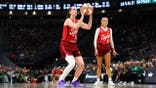 Caitlin Clark shoots a free throw during an Indiana Fever game