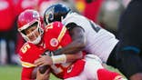 Patrick Mahomes is tackled by Josh Allen on the field at Arrowhead Stadium.