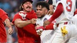 Willson Contreras #40 of the Boston Red Sox is held back during an altercation against the Washington Nationals.