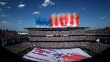 Smoke forming the US national flag during a Fourth of July ceremony before the FIFA World Cup 2026 match in Philadelphia.