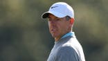 Rory McIlroy looks across the ninth green during a practice round.