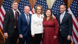 Former Rep. Gabby Giffords, D-Ariz., center, her husband Sen. Mark Kelly, D-Ariz., second from left, Reps. Greg Stanton, D-Ariz., left, Adelita Grijalva, D-Ariz. and House Minority Leader Hakeem Jeffries, D-N.Y., pose for a photo in the U.S. Capitol after a joint resolution was introduced to honor the six people killed in 2011 in Tucson on the 15th anniversary of the shooting that also injured Giffords, on Thursday, January 8, 2026. (Tom Williams/CQ-Roll Call, Inc via Getty Images)