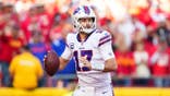 Josh Allen looks to pass during an NFL game
