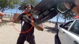 Body camera footage shows a man approaching a Los Angeles County sheriff's deputy while holding a knife in a Lancaster parking lot.