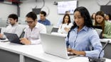 MBA students on laptops