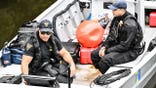 Passaic Police and other assisting towns work the scene inside of the Passaic River where a 10-year-old boy was found dead and an ongoing operation is underway to recover a 10-year-old girl after both children were in the Passaic River in the vicinity of Veterans Ct near a park in Passaic, New Jersey, United States on Thursday, July 30, 2026. Authorities canvassed the area for any clues, evidence and signs of the missing children. The investigation is active and ongoing.