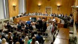 Senate committee room with empty Democratic dais
