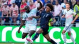 Romelu Lukaku and Chris Richards battle