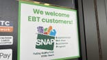 Sign at supermarket entrance with text reading We Welcome EBT customers and a SNAP logo in Lafayette, California, November 13, 2025.