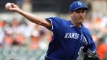 Seth Lugo throws during the first inning at Oriole Park at Camden Yards.