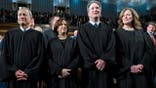 Chief Justice John G. Roberts Jr., Justice Elena Kagan, Justice Neil Gorsuch and Justice Amy Coney Barrett seated at the House Chamber.