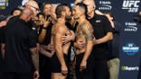 Conor McGregor faces off with Max Holloway during weigh-ins for UFC 329 at T-Mobile Arena.