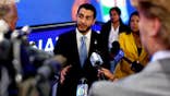 Sen candidate Abdul El-Sayed gestures while speaking with reporters