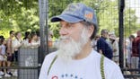 Marine veteran in ball cap attending the Great American State Fair.