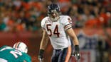 Brian Urlacher lines up against the Miami Dolphins at Sun Life Stadium.
