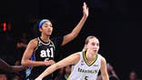 Paige Bueckers #5 of the Dallas Wings plays defense on Angel Reese #5 of the Atlanta Dream