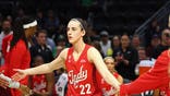 Caitlin Clark stands on the court before the Indiana Fever game