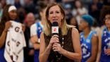 WNBA Commissioner Cathy Engelbert speaks at a podium.