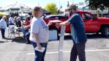 Street preacher Bryan Conwell holding anti-abortion sign.